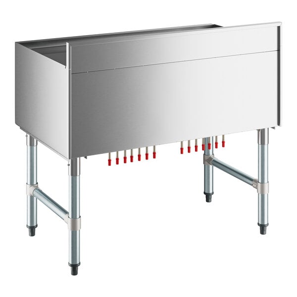 A stainless steel Regency underbar ice bin with red tubes.