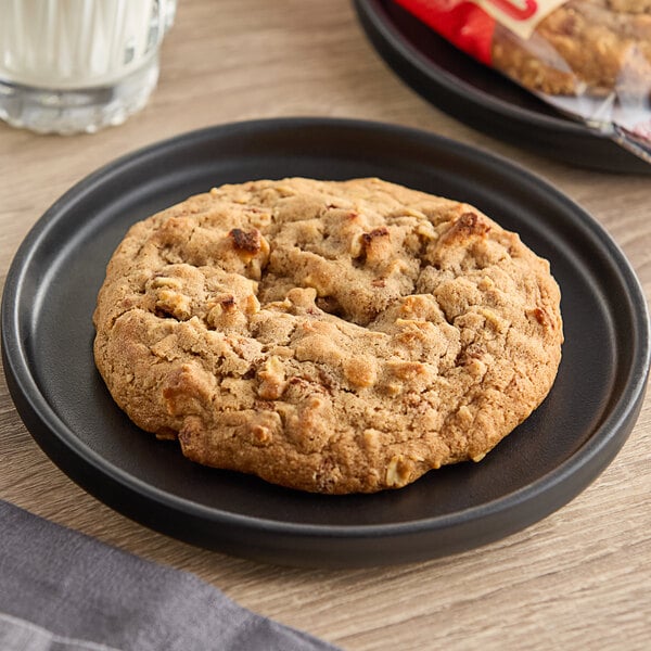 An Otis Spunkmeyer apple cinnamon oatmeal cookie on a plate.
