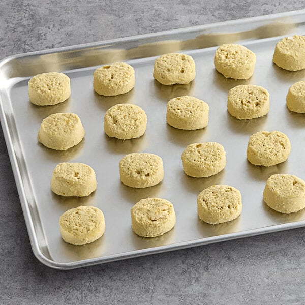 A tray of Otis Spunkmeyer Lemon Burst cookie dough on a gray surface.