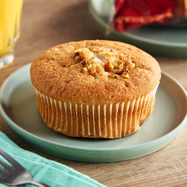 An Otis Spunkmeyer banana nut muffin on a plate.