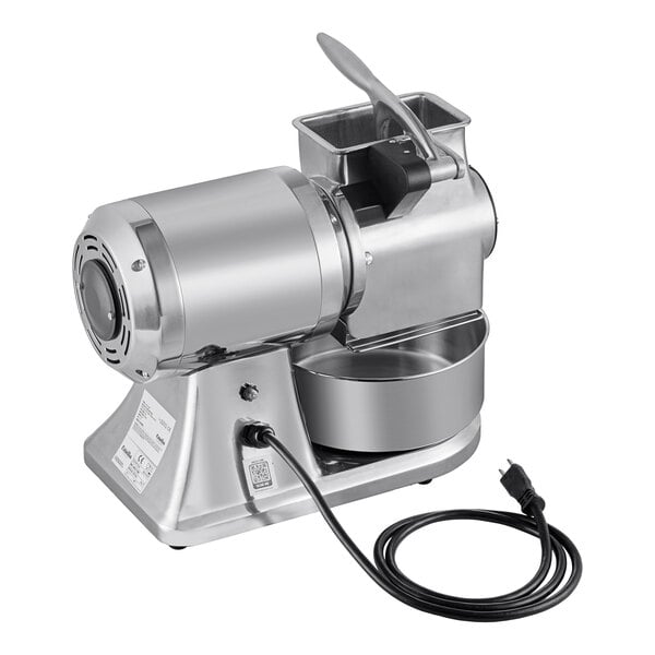 An electric hard cheese grater with a stainless steel body, a feeding chute, a collection bowl, and a power cord.