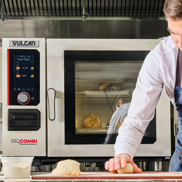 A commercial Vulcan Chef'sCombi electric combi oven with a digital control panel and a glass door, shown in a professional kitchen setting.