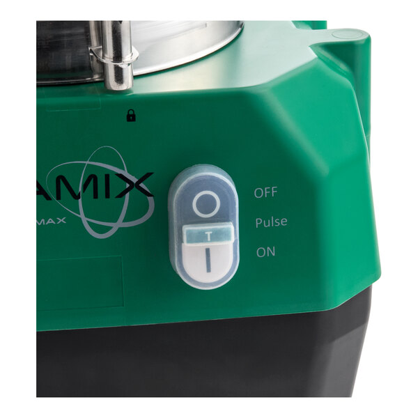 A green and black food processor base with a control switch labeled OFF, Pulse, and ON.