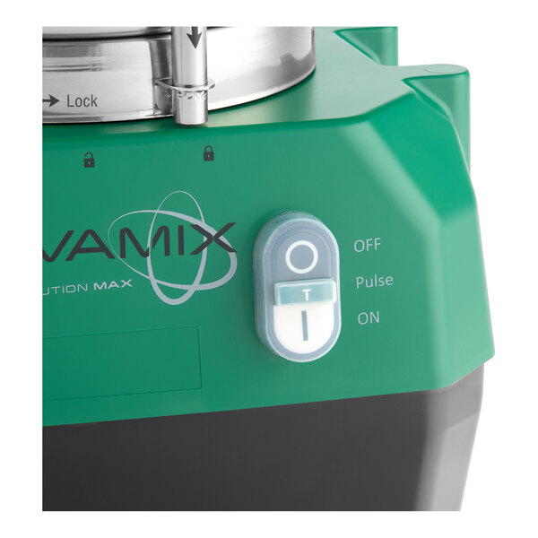 A green AvaMix Revolution Max combination food processor with a control switch and part of a stainless steel bowl visible.