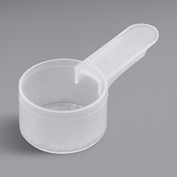 An 11 cc white plastic scoop with a short handle.
