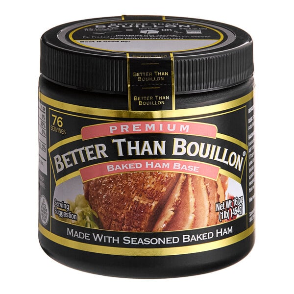 A black jar of Better Than Bouillon Premium Baked Ham Flavor Base on a table.