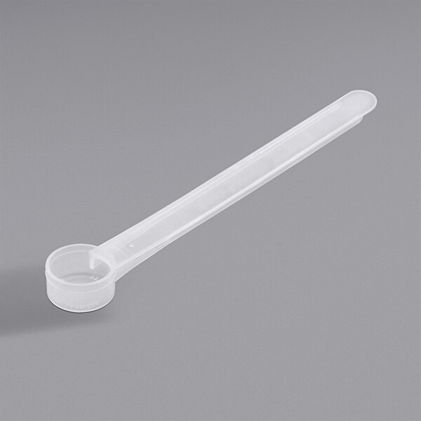 A 3 cc polypropylene measuring scoop with a long handle.