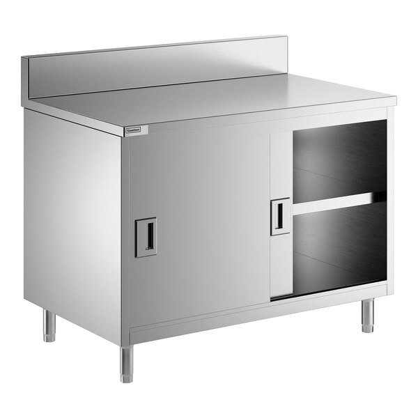 A stainless steel enclosed base table with sliding doors, a midshelf, and a 6-inch backsplash.