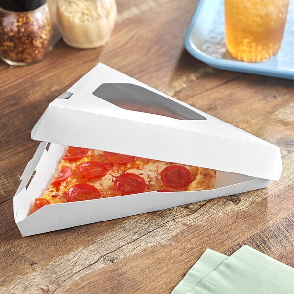 A Southern Champion white pizza slice box with a pizza inside.