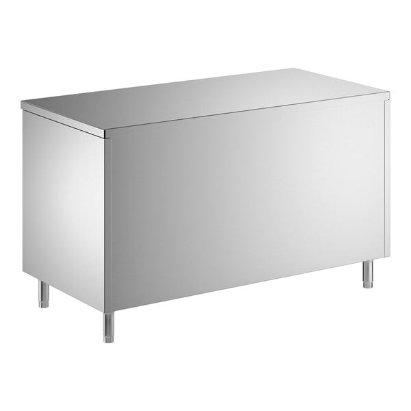 A stainless steel enclosed base table with sliding doors and a midshelf.