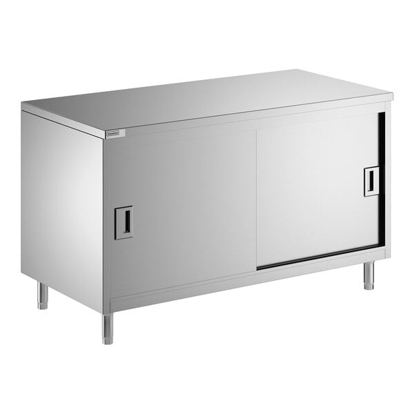 A stainless steel enclosed base table with sliding doors and a midshelf.