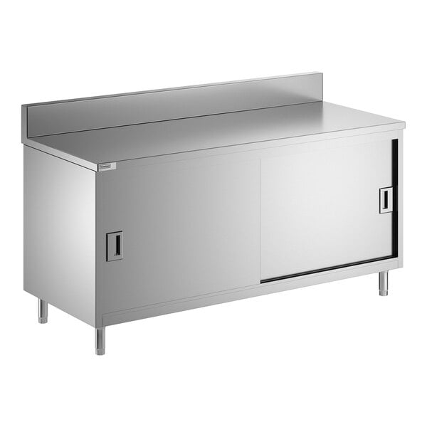 A stainless steel enclosed base table with sliding doors, a midshelf, and a 6-inch backsplash.