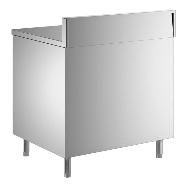 A stainless steel enclosed base table with sliding doors, a midshelf, and a 6-inch backsplash.