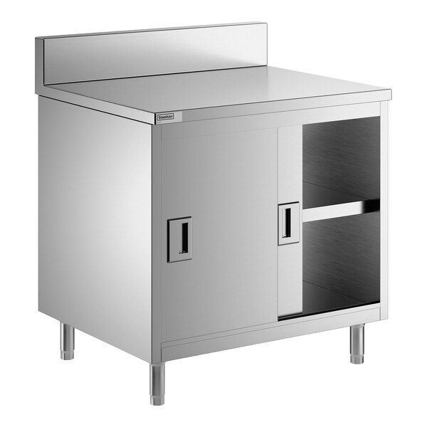 A stainless steel enclosed base table with sliding doors, a midshelf, and a 6-inch backsplash.