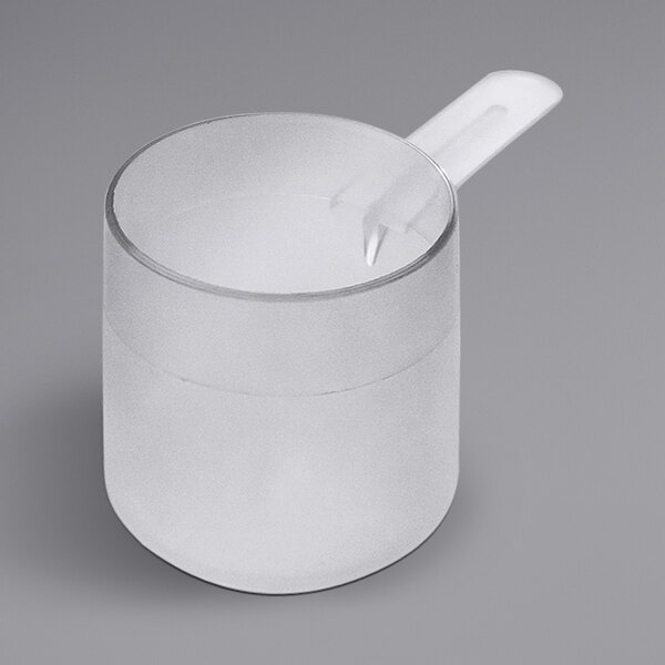 A clear plastic cup with a medium handled polypropylene scoop on top.