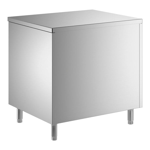 A stainless steel enclosed base table with sliding doors and a midshelf.