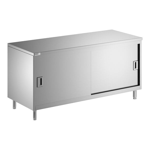 A stainless steel enclosed base table with sliding doors and a midshelf.