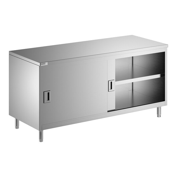 A stainless steel enclosed base table with sliding doors and a midshelf.