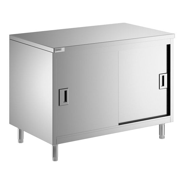 A stainless steel enclosed base table with sliding doors and a midshelf.