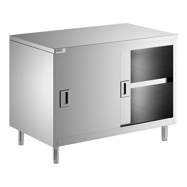 A stainless steel enclosed base table with sliding doors and a midshelf.