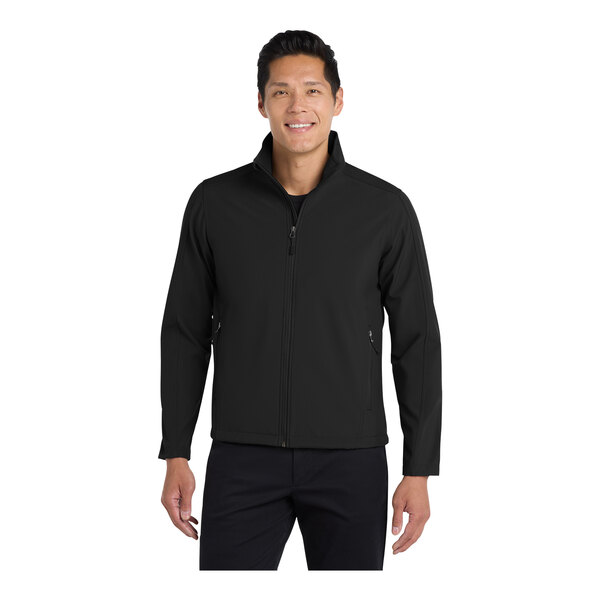 A man wearing a black Port Authority core soft shell jacket.