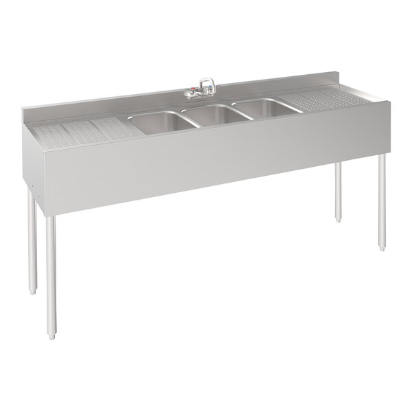 A Krowne stainless steel underbar sink with 3 bowls and 2 drainboards.