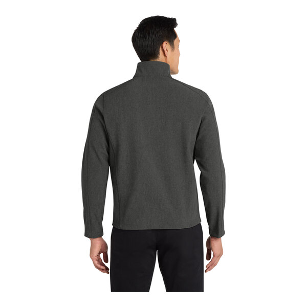 A man wearing a black and charcoal heather Port Authority Core Soft Shell Jacket.