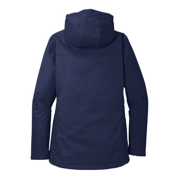 A woman wearing a navy Port Authority parka jacket with a hood.