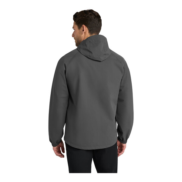 A man wearing a graphite Port Authority Essential Rain Jacket.
