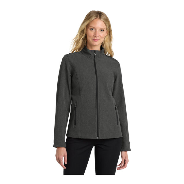 A woman wearing a Port Authority charcoal heather soft shell jacket.