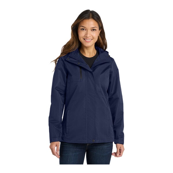 A woman wearing a Port Authority True Navy parka jacket.