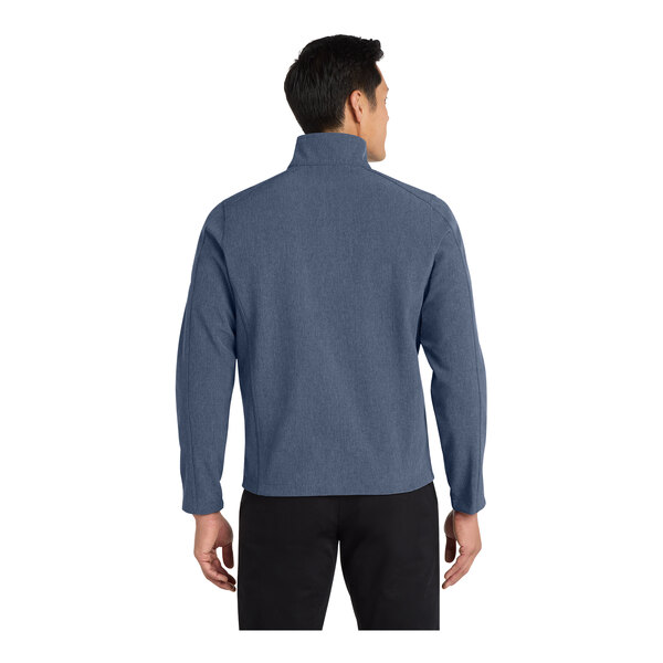 A man wearing a navy Port Authority Core Soft Shell Jacket.