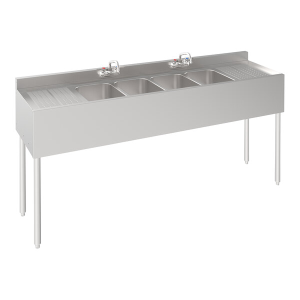 A Krowne stainless steel underbar sink with 4 bowls and 2 drainboards.