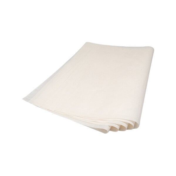A stack of white folded paper filters.