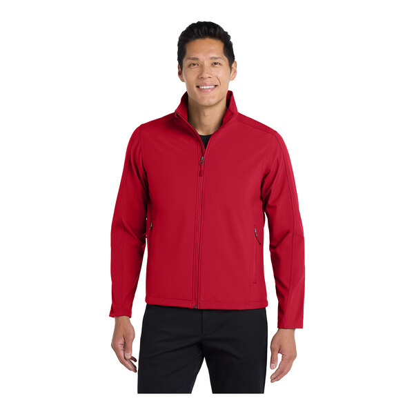 A man wearing a rich red Port Authority Core Soft Shell Jacket.