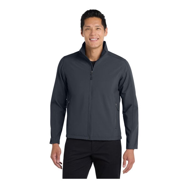 A man wearing a grey Port Authority Core Soft Shell Jacket.
