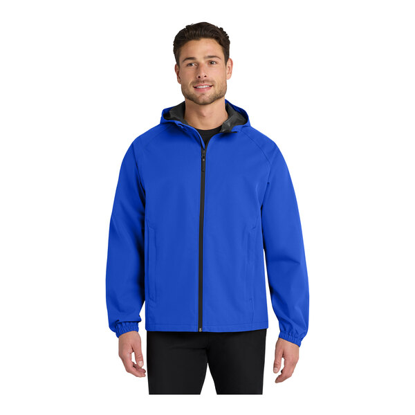 A man wearing a bright blue Port Authority rain jacket with black trim.