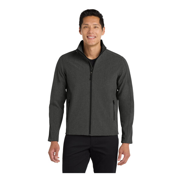 A man wearing a black and grey Port Authority Core Soft Shell jacket.
