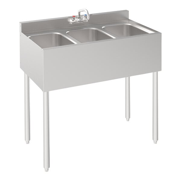 A Krowne stainless steel underbar sink with three bowls and a faucet.