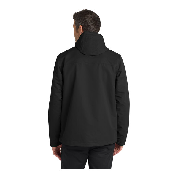 A person wearing a Port Authority black parka jacket.