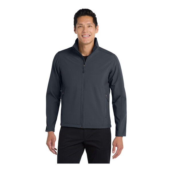 A man wearing a Port Authority core soft shell jacket in battleship gray.
