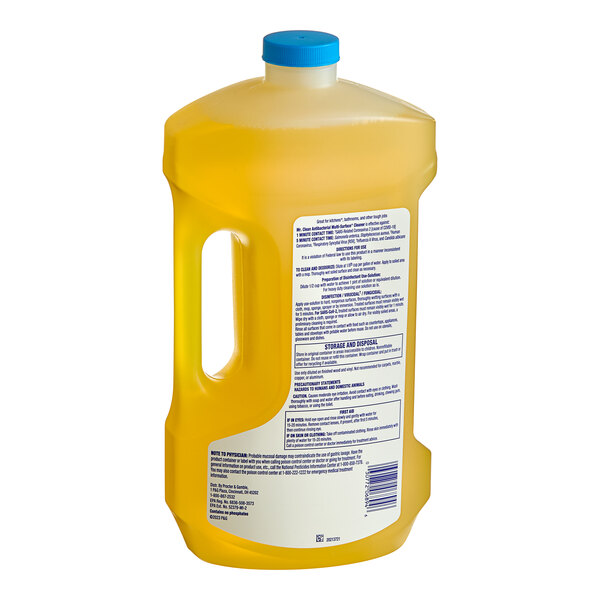 A close-up of a Mr. Clean 2X concentrated lemon-scented liquid cleaner in a gallon bottle with a blue cap.