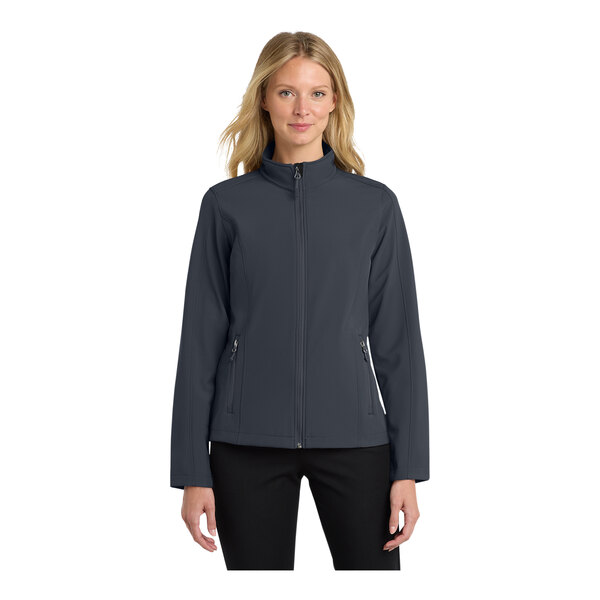 A woman wearing a Port Authority Core Soft Shell jacket in battleship gray.