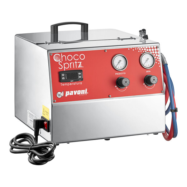 A stainless steel countertop electric chocolate sprayer with a red control panel, gauges, and attached hoses.