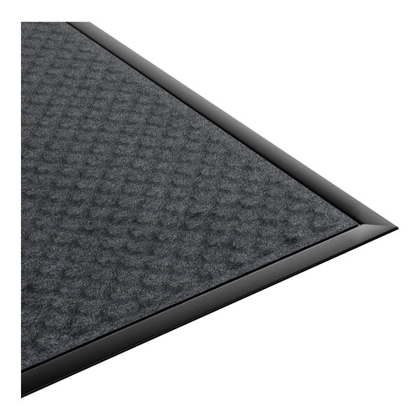 A rectangular black anti-fatigue entrance mat with a textured surface and beveled edges.