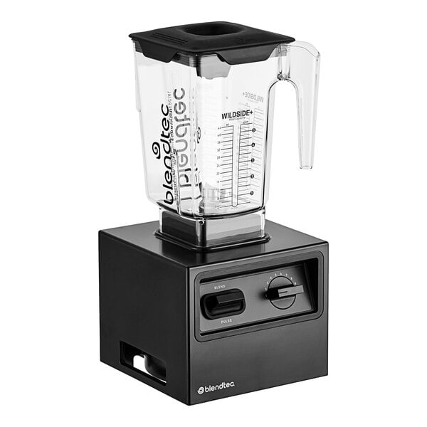 A black Blendtec bar blender on a counter with a clear container.