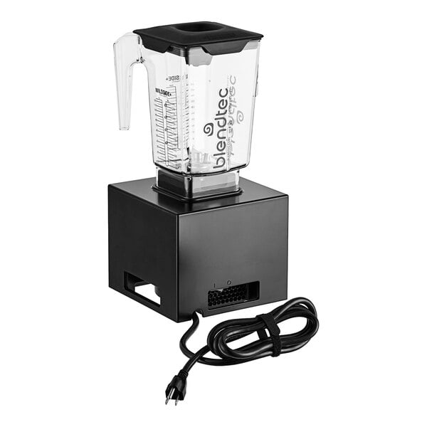 A Blendtec bar blender with a clear plastic container and a black lid on a counter with a cord attached.