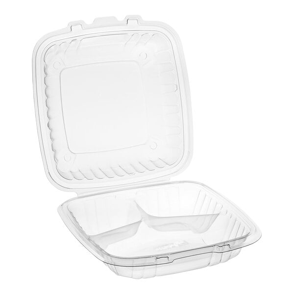 A Dart clear hinged plastic take-out container with three compartments and a lid.