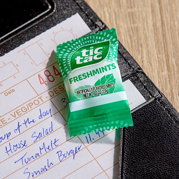 A TIC TAC Freshmint mini packet on a receipt.