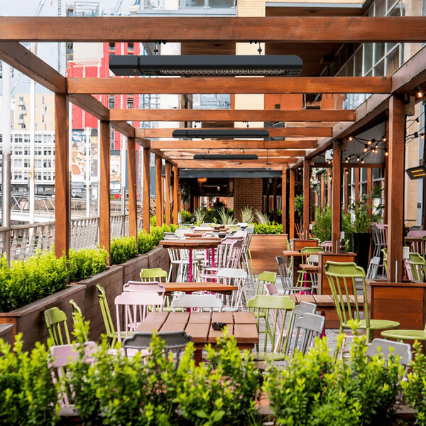 A Ghost infrared patio heater on a restaurant patio table.